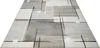 A rectangular rug with an abstract geometric pattern is shown from a low angle, isolated on a white background. Produktbild-Vorschau
