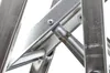 A close-up view of the metal joints and structure of a ladder. Náhľad obrázku produktu