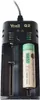 A black battery charger with a lithium-ion battery inserted. Produktbild-Vorschau