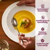 A close-up of a bowl of soup with a shrimp and garnish, with a spoon being held by a hand. The right side of the image contains marketing text and icons. Náhled obrázku produktu