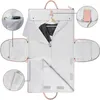 An open garment bag with clothing and accessories inside, showing its compartments and features. Produktbild-Vorschau