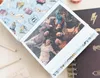 A close-up view of an open photo album with a family photo inside, placed next to a Harry Potter themed notebook. Anteprima dell’immagine prodotto