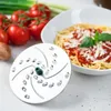 A food processor attachment and a bowl of spaghetti with tomato sauce and cheese are on a white table. Anteprima dell’immagine prodotto