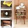 A collage of images showing a rustic brown nightstand with drawers and wooden legs, along with close-ups of its features. Náhled obrázku produktu