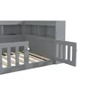 A close-up view of a gray wooden bed frame with a built-in bookshelf and a removable guardrail. Produktbild-Vorschau