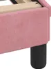 A close-up view of the side and leg of a pink upholstered bed frame. Produktbild-Vorschau