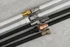 A collection of flexible hoses with different colored connectors laid out diagonally on a textured gray surface. Anteprima dell’immagine prodotto