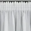 A close-up view of white sheer curtains hanging from a curtain rod. Produktbild-Vorschau