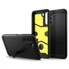 Three black phone cases are displayed against a white background. One case is shown from the side with its kickstand extended, another is shown from the back, and the third is shown from the back with its interior, which is bright yellow, visible. Náhľad obrázku produktu
