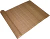 A rolled-up bamboo mat on a white background. Produktbild-Vorschau