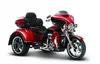 A red Harley Davidson trike motorcycle is shown from a three-quarter front angle against a white background. Anteprima dell’immagine prodotto