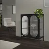 A modern living room with a black glass cabinet and a chair. Náhľad obrázku produktu