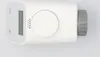 A white electronic thermostat head is shown against a white background. Produktbild-Vorschau