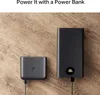 Two black power banks are shown on a wooden surface, with one connected to a cable. Anteprima dell’immagine prodotto