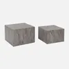 Two square coffee tables with a marble look, one larger than the other, are displayed against a white background.