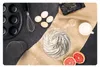 A flat lay of baking ingredients and kitchen tools, including a hand mixer, eggs, a bowl of whipped cream, a muffin tin, and grapefruit. Náhľad obrázku produktu