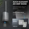 A toilet brush holder mounted on a dark tiled wall, with text overlays highlighting its features. Produktbild-Vorschau