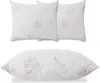 Three white pillows with an aloe vera pattern are displayed against a white background. Two square pillows are stacked on top of each other, and one rectangular pillow is shown below them. Produktbild-Vorschau