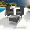 Outdoor furniture set with chairs and a table on a patio next to a pool with the ocean in the background. Náhled obrázku produktu