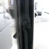 A close-up view of a fireplace door hinge and seal. Produktbild-Vorschau