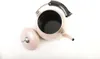 A pink teapot with a black handle and a silver lid is shown from a top-down perspective on a white background. Podgląd zdjęcia produktu