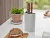 A knife block with knives, a potted plant, and sliced bread on a kitchen counter. Produktbild-Vorschau