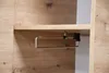 A close-up view of a towel rack attached to a wooden shelf. Produktbild-Vorschau