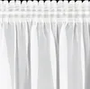 A close-up view of white sheer curtains hanging from a rod. Produktbild-Vorschau