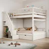 A white wooden bunk bed with stairs and storage drawers in a child's bedroom. Náhled obrázku produktu