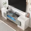 A modern TV stand with integrated LED lighting, displaying electronic devices and decorative items. Podgląd zdjęcia produktu