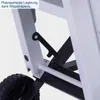 Close-up view of a mechanical component of a machine, likely a saw, showing a wheel and a locking mechanism. Produktbild-Vorschau