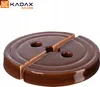 A brown ceramic weight for a fermentation crock. Náhled obrázku produktu
