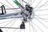 A close-up view of the rear wheel and drivetrain of a bicycle. Produktbild-Vorschau