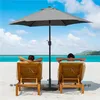 Two people relaxing on lounge chairs on a beach under a large gray umbrella. Produktbild-Vorschau