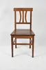 A wooden chair against a white background. Produktbild-Vorschau