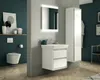 A modern bathroom with a toilet, sink, and storage cabinet. Anteprima dell’immagine prodotto