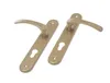 Two gold door handles with escutcheons are displayed on a white background. Podgląd zdjęcia produktu