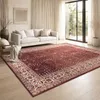 A living room with a sofa and a rug. Produktbild-Vorschau