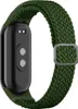 The back of a smart band with a green woven nylon strap.