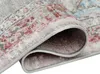 A close-up view of a rolled-up rug, showing its texture and pattern. Produktbild-Vorschau