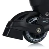 A close-up view of a black inline skate wheel and part of the frame. Voir les images du produit