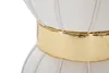 A close-up view of a cream-colored hocker with a gold band around its middle. Produktbild-Vorschau