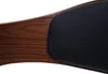 A close-up view of a wooden chair armrest with a black leather cushion. Produktbild-Vorschau