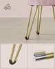 Close-up of a pink velvet stool with gold hairpin legs, showing detail of the leg caps and construction. Also includes a smaller inset image of the stool leg caps. Náhled obrázku produktu