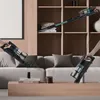 Two people are using HOOVER vacuum cleaners in a modern living room setting. Produktbild-Vorschau