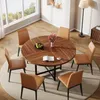 A round dining table with chairs in a well-lit room with large windows. Produktbild-Vorschau