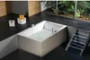 A modern bathroom with a bathtub filled with water, plants visible through a large window, and decorative baskets. Produktbild-Vorschau