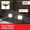 Construction site with building materials and a work light. Produktbild-Vorschau