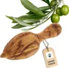 A wooden olive oil press and a branch with olives on a white background. Produktbild-Vorschau