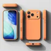 Multiple views of an orange phone case arranged on a light gray surface. Náhled obrázku produktu